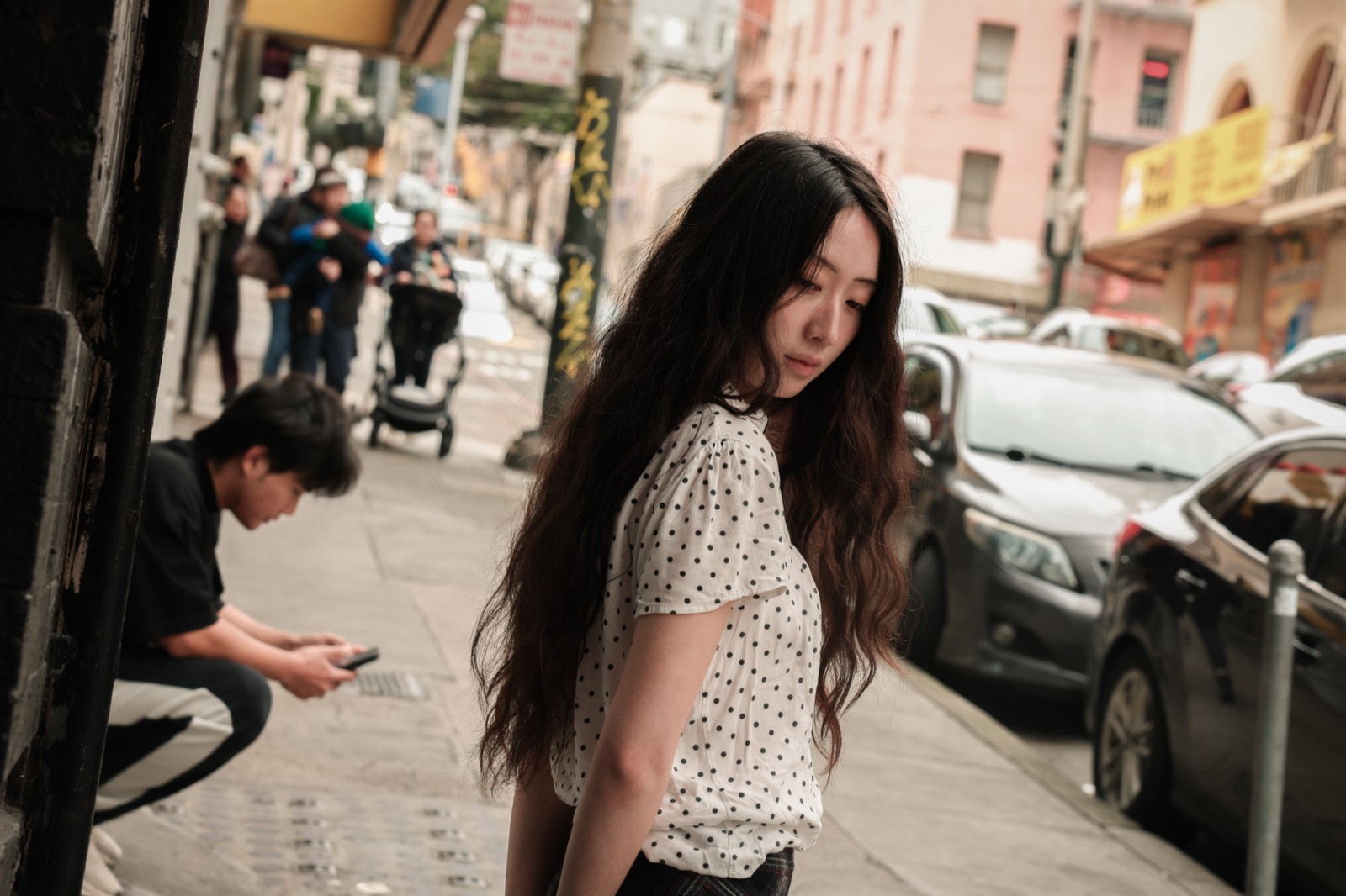A woman turning on a busy city street